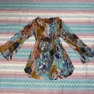 Long-sleeved light blue and tan chiffon blouse with abstract pattern